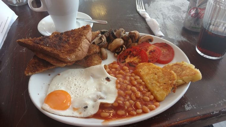 Full English breakfast on a white plate